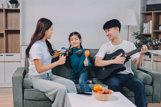 Family playing music together at home photo