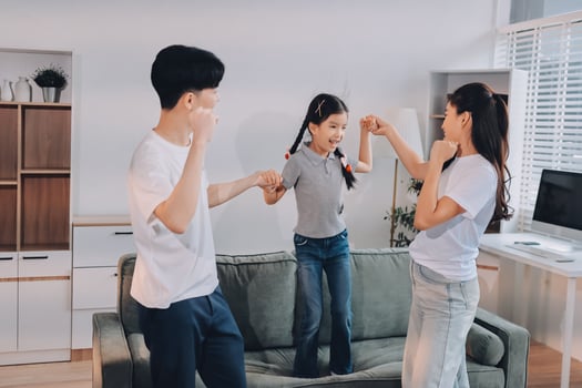 Family dancing in the living room photo