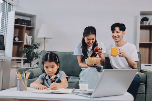 Family with child at home enjoying snacks photo