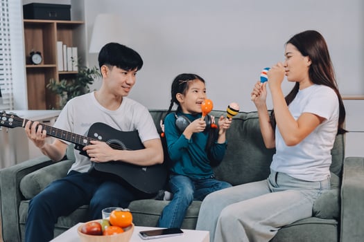 Family playing music together at home photo