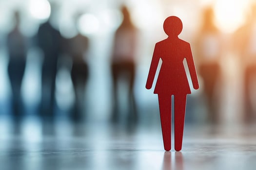 Red female figure stands out from blurred business crowd. photo