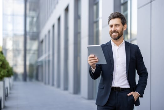 Businessman with tablet in urban area photo