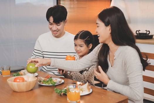 Family enjoying a meal together at home photo