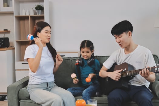 Family playing music together at home photo