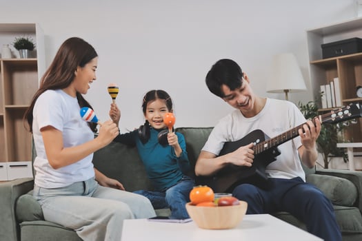 Family playing music together at home photo