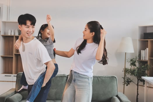 Family having fun in living room photo