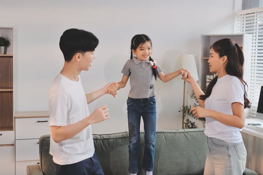 Family playing together in living room photo