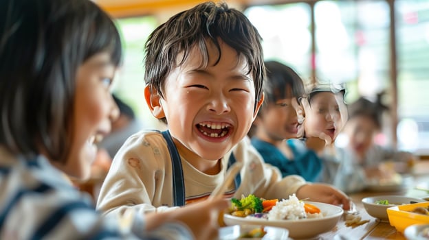 Happy children eating lunch together at table smiling and sharing meal photo