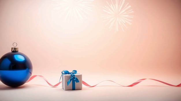 Blue christmas bauble and gift box on pink background photo
