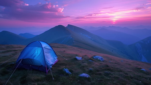 Camping tent at sunset on mountain peak adventure and outdoor living photo