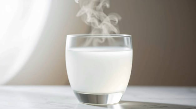 Steam Rising from a Glass of Warm Liquid Clean Minimalist Product Photography Beverages photo