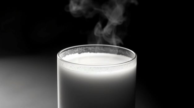 Warm Milk in Glass Steaming Beverage Black and White Photography Beverages photo