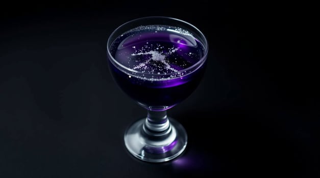 A purple liquid in a glass with a star on it photo