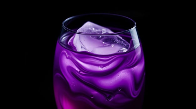 A purple liquid in a glass with ice photo