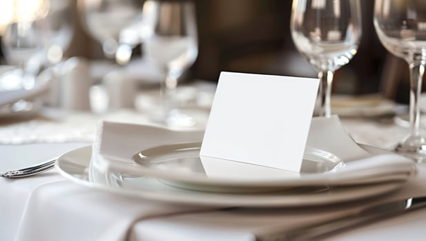 Elegant table setting with blank card for invitation or message photo