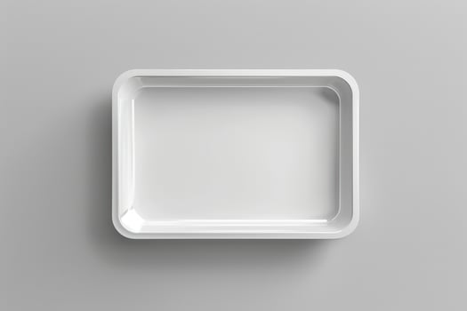 Clean white plastic tray on gray background overhead studio shot minimalist design photo