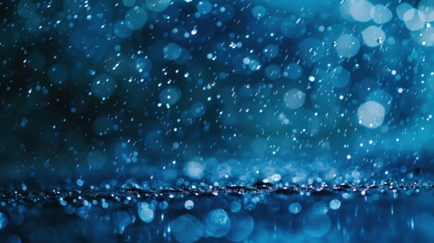 Blue raindrops falling in heavy rainfall with blurred background photo