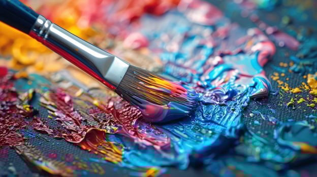 Paintbrush on colorful canvas with abstract acrylic paint texture photo