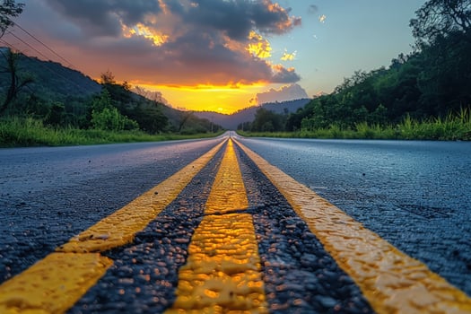 Road to sunset empty highway landscape with mountain and sky photo