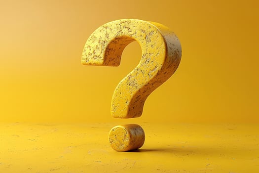 Yellow textured question mark symbol of inquiry and problem solving photo
