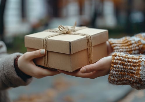 Giving gift box small cardboard present handheld exchange photo
