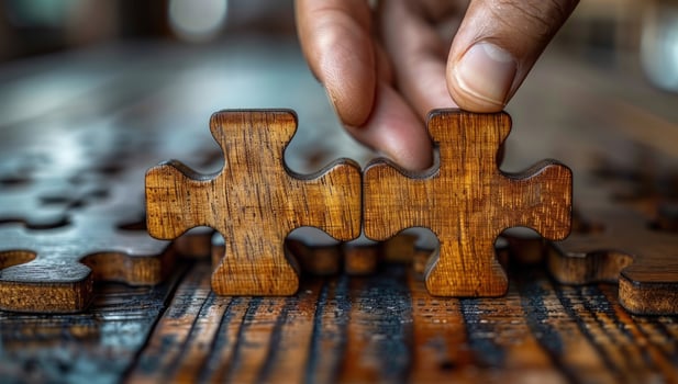 Jigsaw puzzle solution wooden game pieces connecting photo