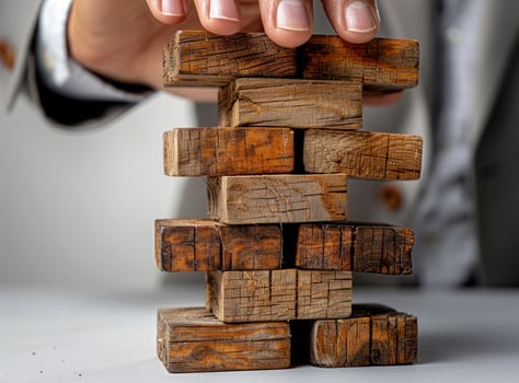 Wooden block tower in progress building strategy and stability photo