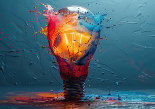 Light bulb explosion with vibrant paint colors abstract concept photo