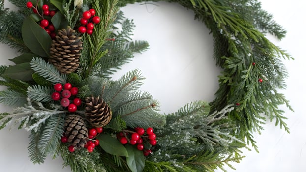 Festive Christmas Wreath with Pine Cones and Red Berries on White Background, Holiday Decor, Seasonal Greetings, Evergreen Branches photo