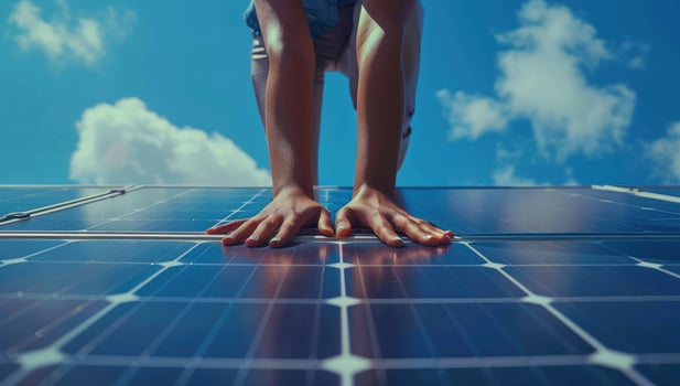 Solar panel energy with cloudscape and human touch for sustainable future photo