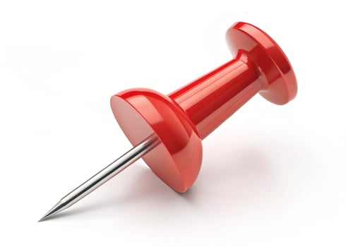 Red Push Pin with Silver Metal Point on White Background pushpin thumbtack photo