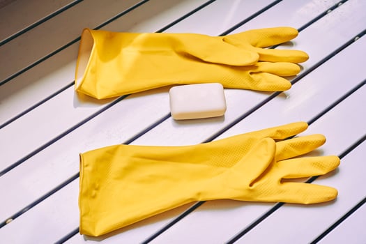 All purpose cleaning kit. Yellow rubber gloves,soap photo