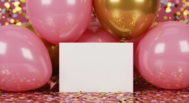 Minimal white card surrounded by festive pink and gold balloons with confetti backdrop. photo