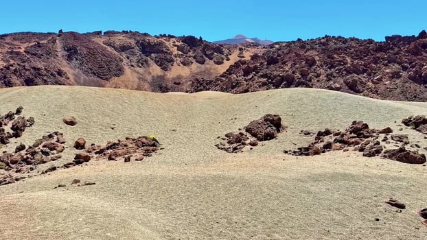 A Stunning Rocky Landscape Featuring a Crystal Clear Blue Sky Above the Breathtaking Terrain photo