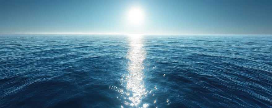 A bright sun shines over the vast blue ocean, with a shimmering path of light reflecting on the water. photo