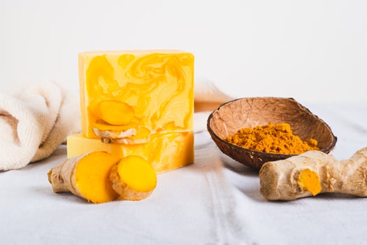 Natural homemade rejuvenating soap with turmeric on the table photo