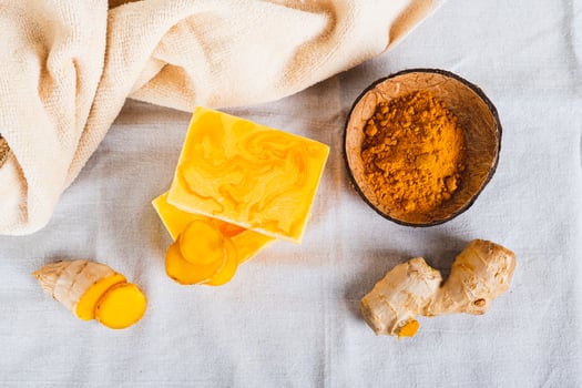 Natural homemade rejuvenating soap with turmeric on the table top view photo