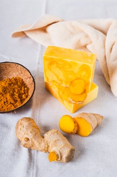 Organic Moisturizing Turmeric Soap Bars on Table vertical view photo