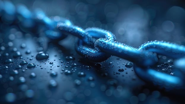 Closeup of a blue metal chain with water droplets on a dark background. photo