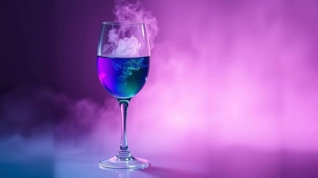 A glass of wine with smoke coming out of it photo