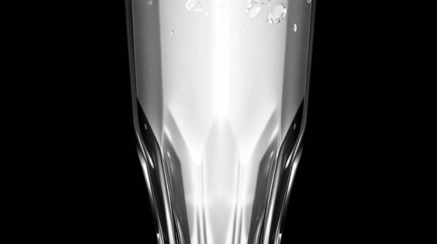 A glass of beer on a black background photo