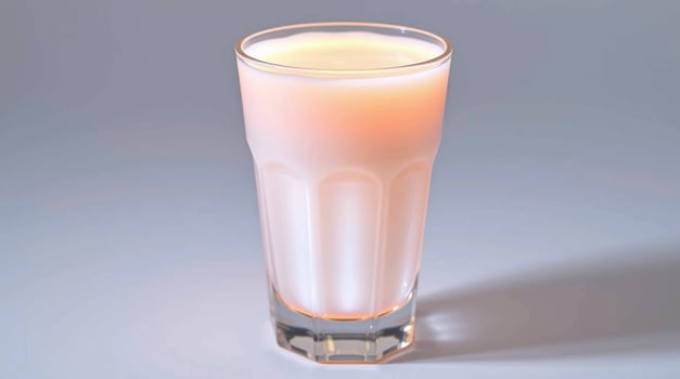 Glass of Milk Pale Pink Hue Studio Lighting Beverages photo
