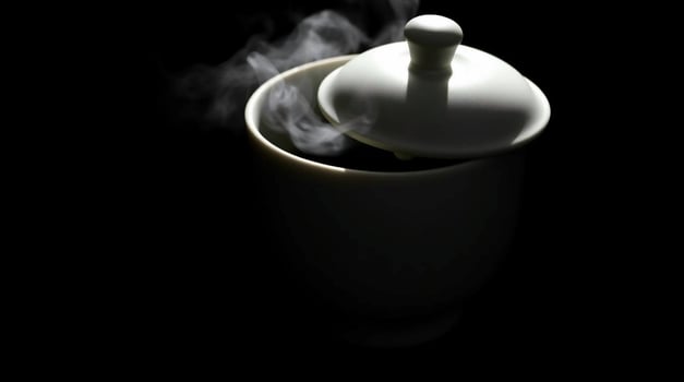 A white tea pot with smoke coming out of it photo