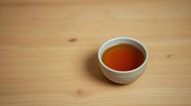Warm Cup of Tea on Light Wood Table Beverages photo