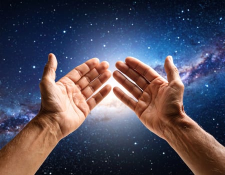 Reaching towards vast expanse of universe, two weathered and calloused hands symbolize connection to cosmos, evoking sense of wonder and exploration photo