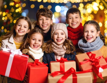 Group of children holding christmas presents photo