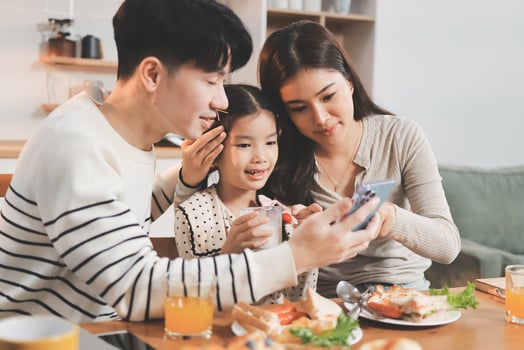 Family enjoying breakfast together photo