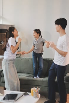Family playing in a living room photo