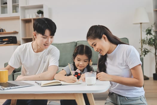 Family interacting with child at home photo