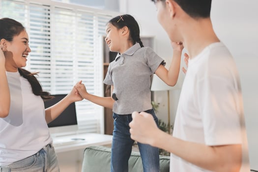 Family playing and bonding indoors photo